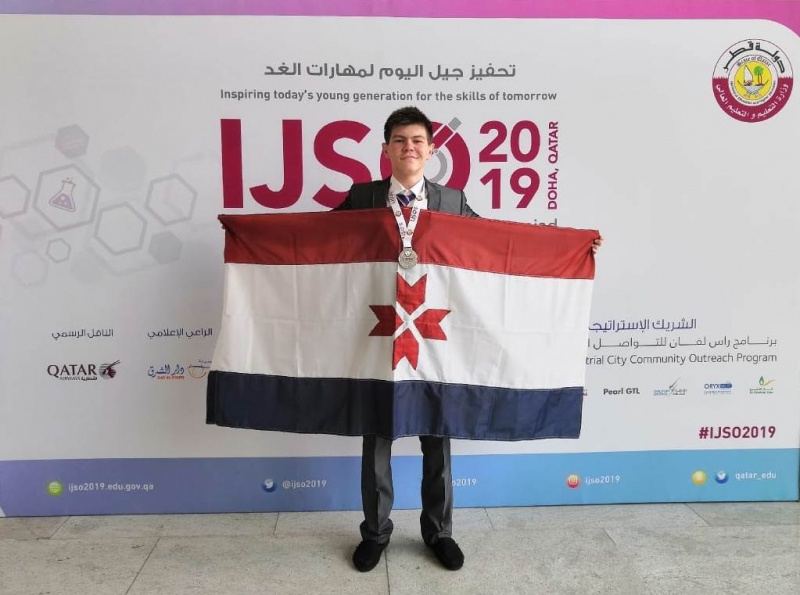 Ilia Prosianoi at physics olympiad with medal